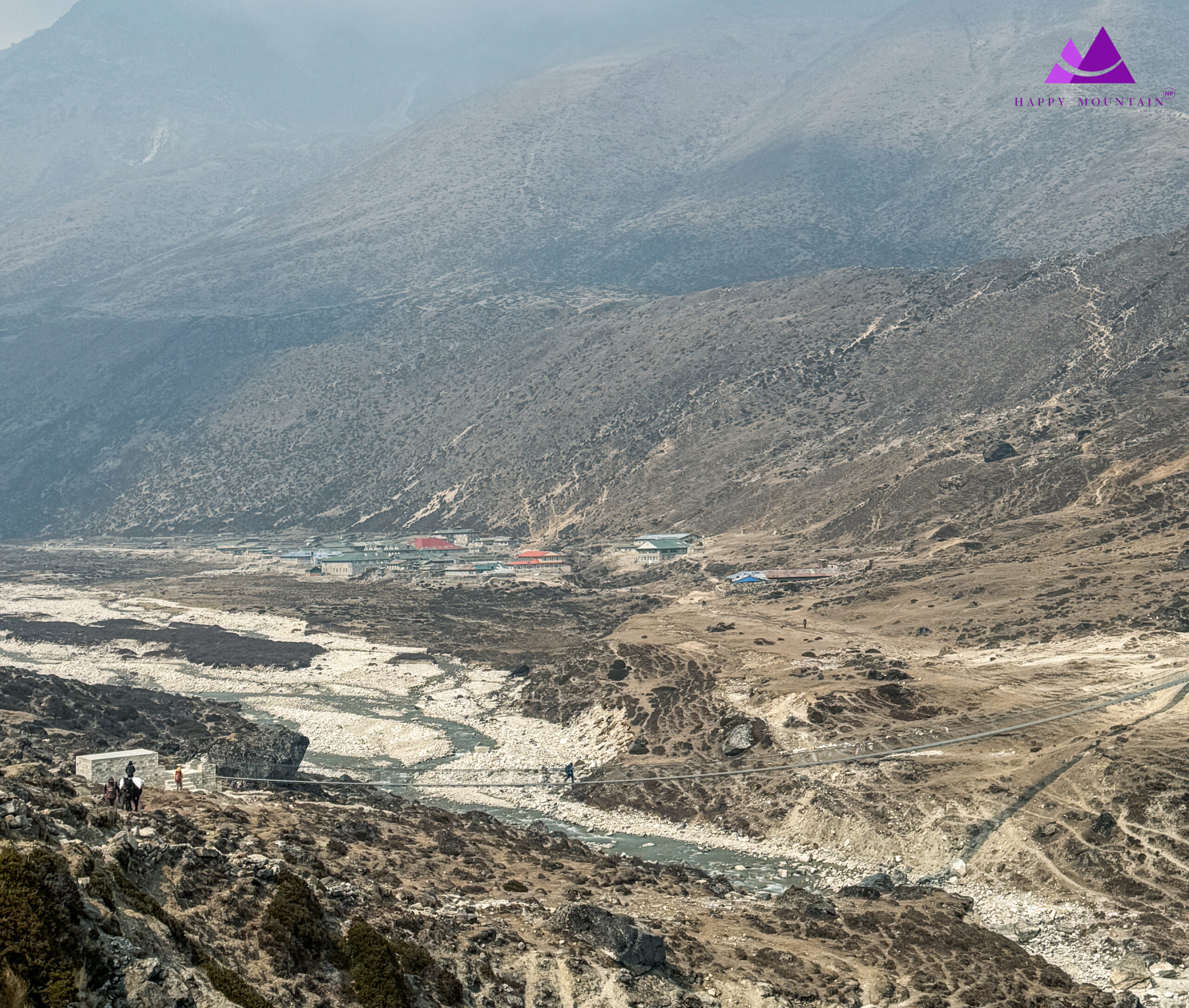 Pheriche village with newly bridge & mountains surrounding 