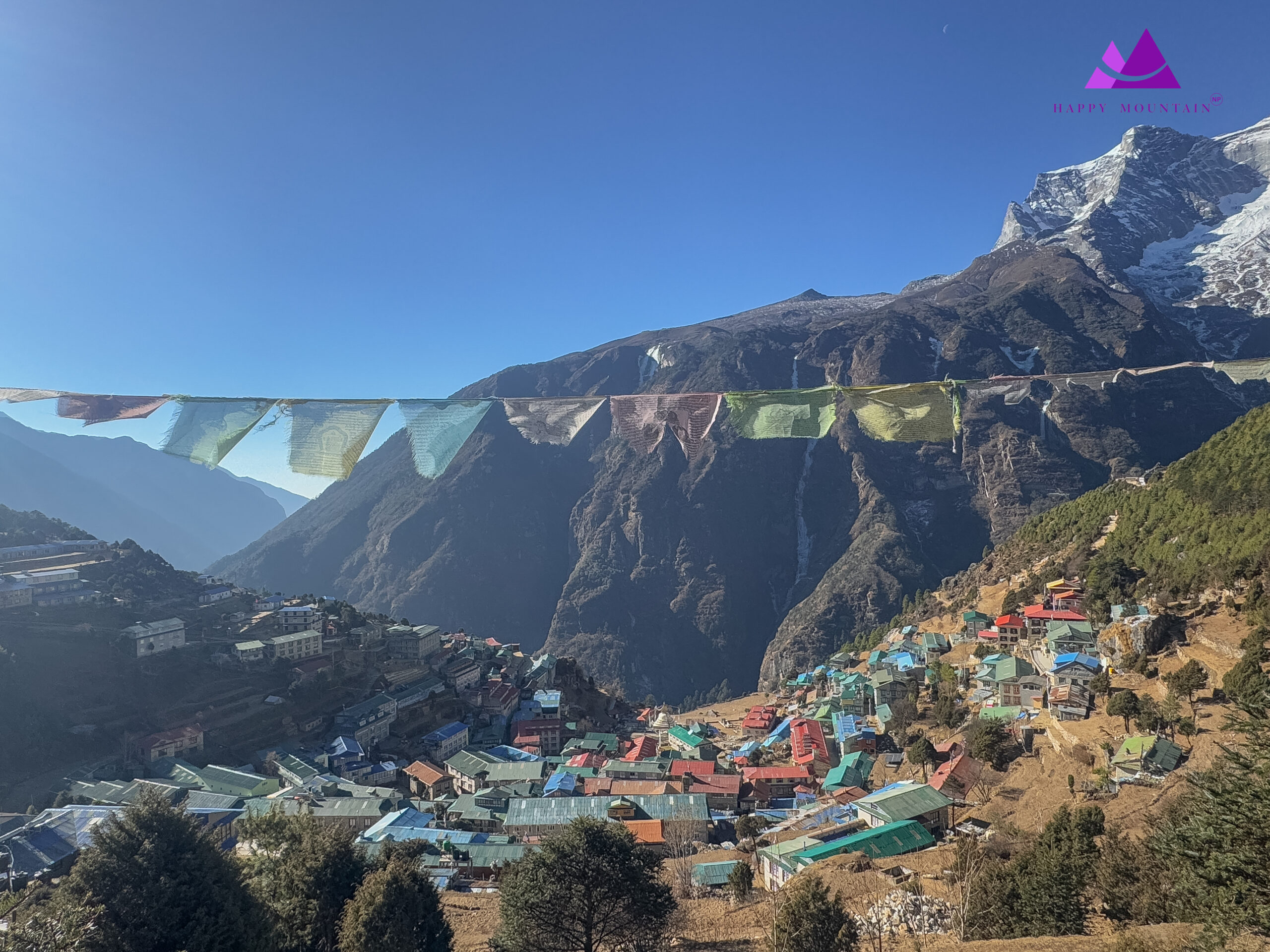 Beautiful Namche Bazar with Prayer flag & Mountain in the Background