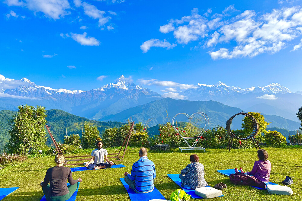 Morning yoga with Annapurna Himalayas in the Background at Astham