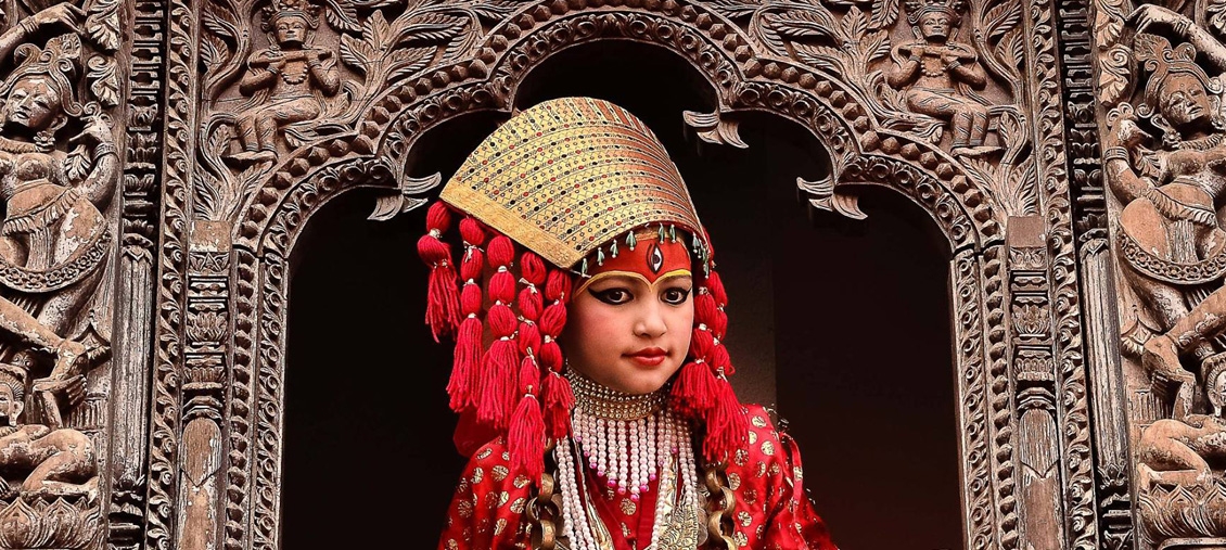 living goddess kumari giving blessing from window