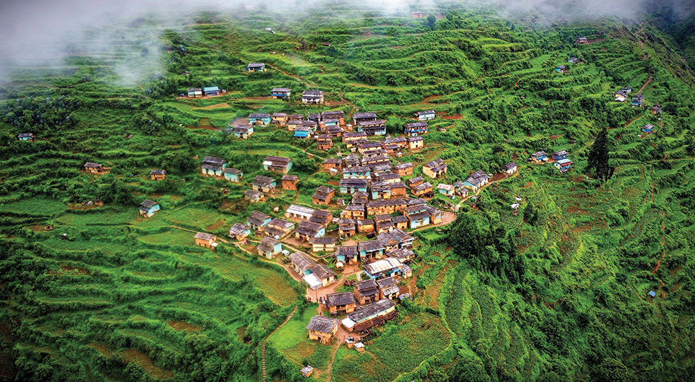 Arial View of Rukum Village with mansoon clouds & greenerary