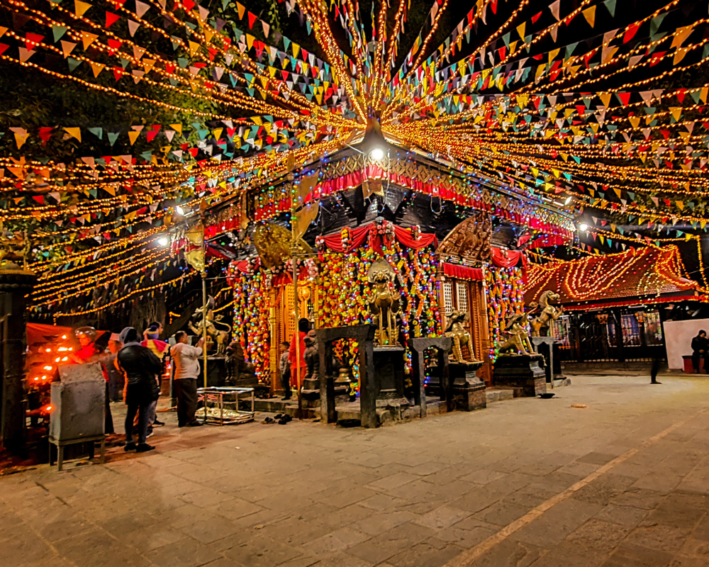 Maitidevi temple decorated with lights and flowers during tihar
