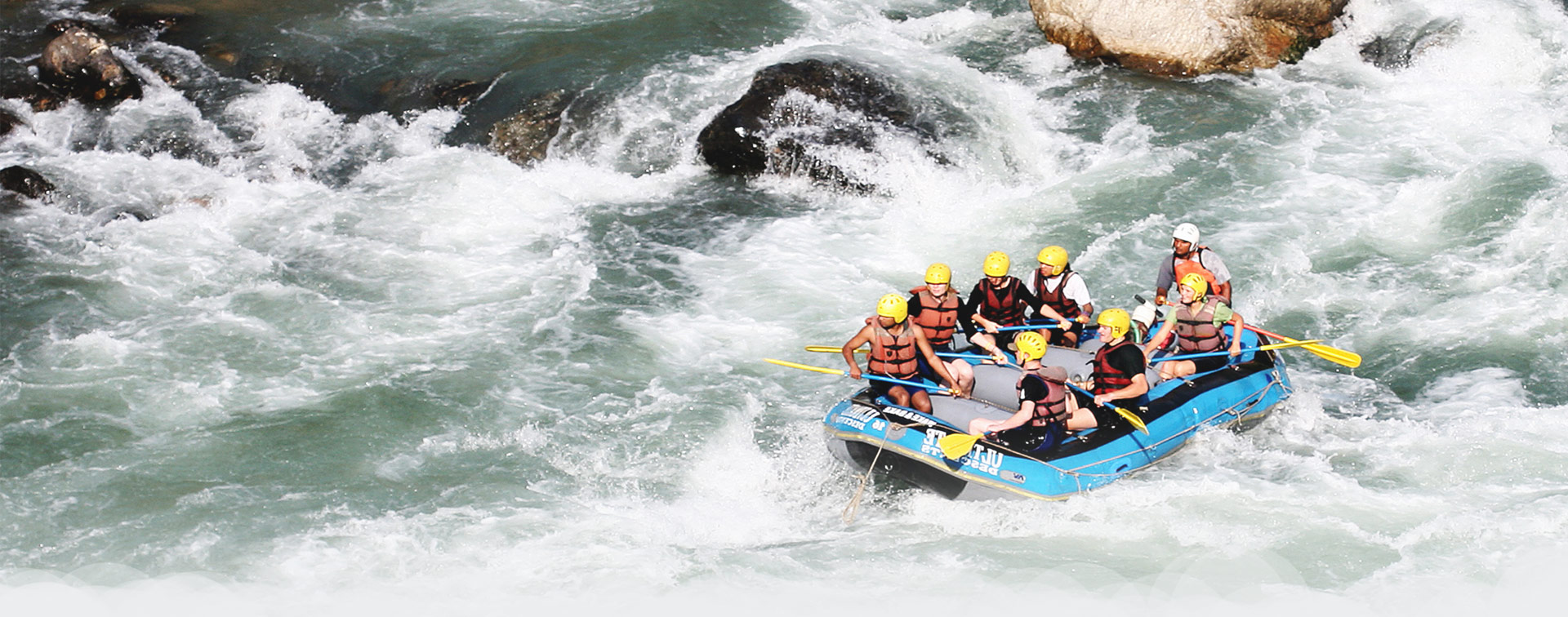 White Water Rafting: Ride by the group of people in Himalayan Rapids