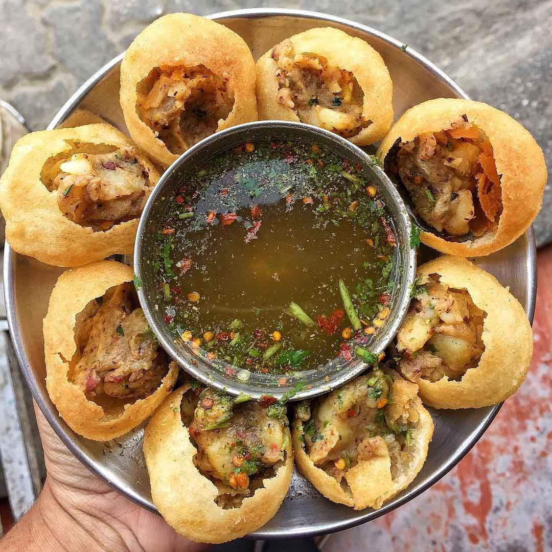 Pani Puri, a popular street food snack from India and other parts of South Asia, also known by names such as Golgappa or Phuchka depending on the region.