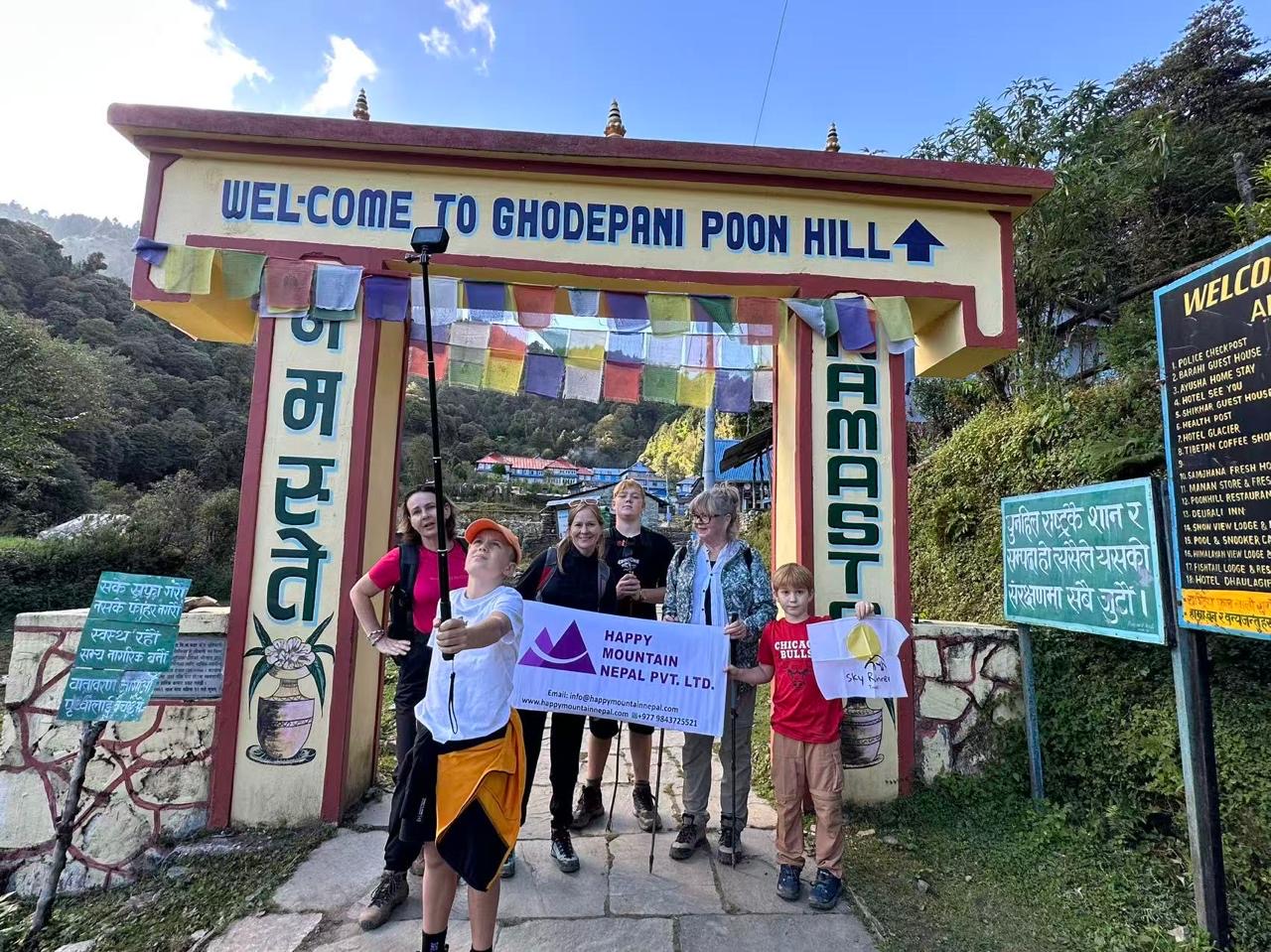 group of people taking selfie while travelling with Happy Mountain