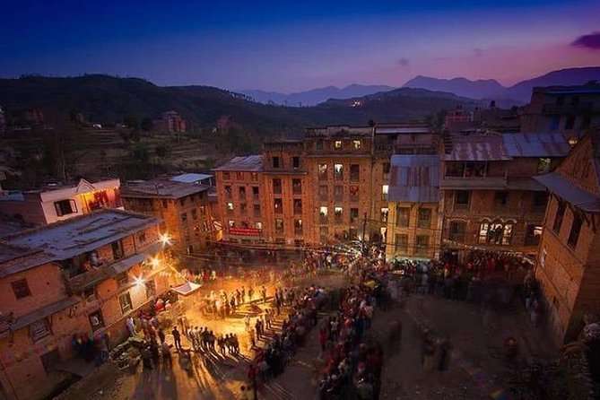 people celebrating somekind of festival all together, different colour light around old houses